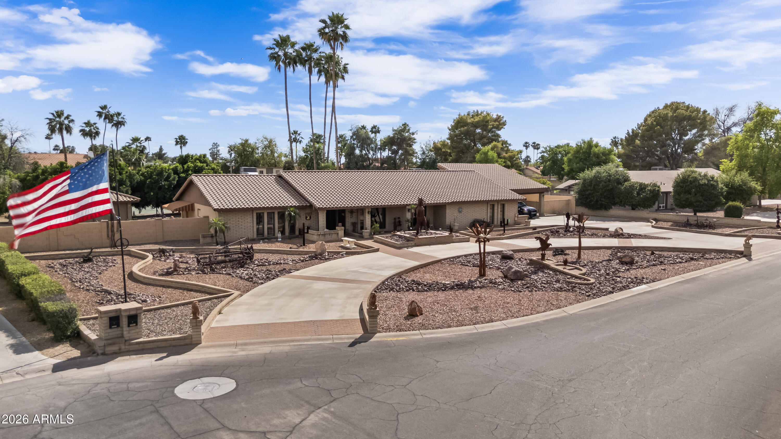 a view of a house with swimming pool and sitting area