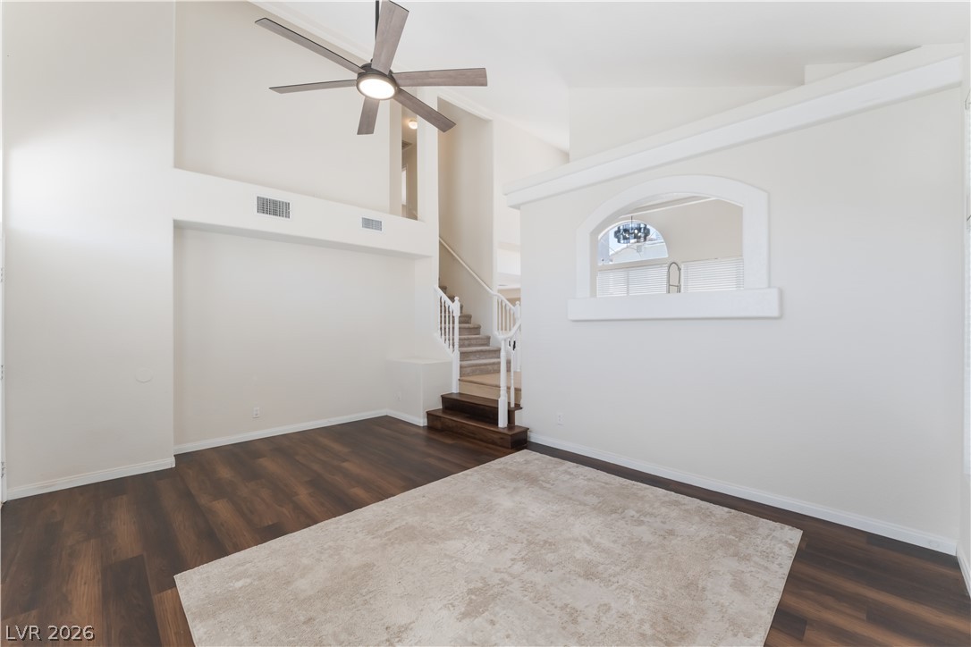 8872 Chapman Point Las Vegas, NV 89129 - Photo 5 of 29 A grand entrance with soaring ceilings and rich wood flooring creates a welcoming first impression.
