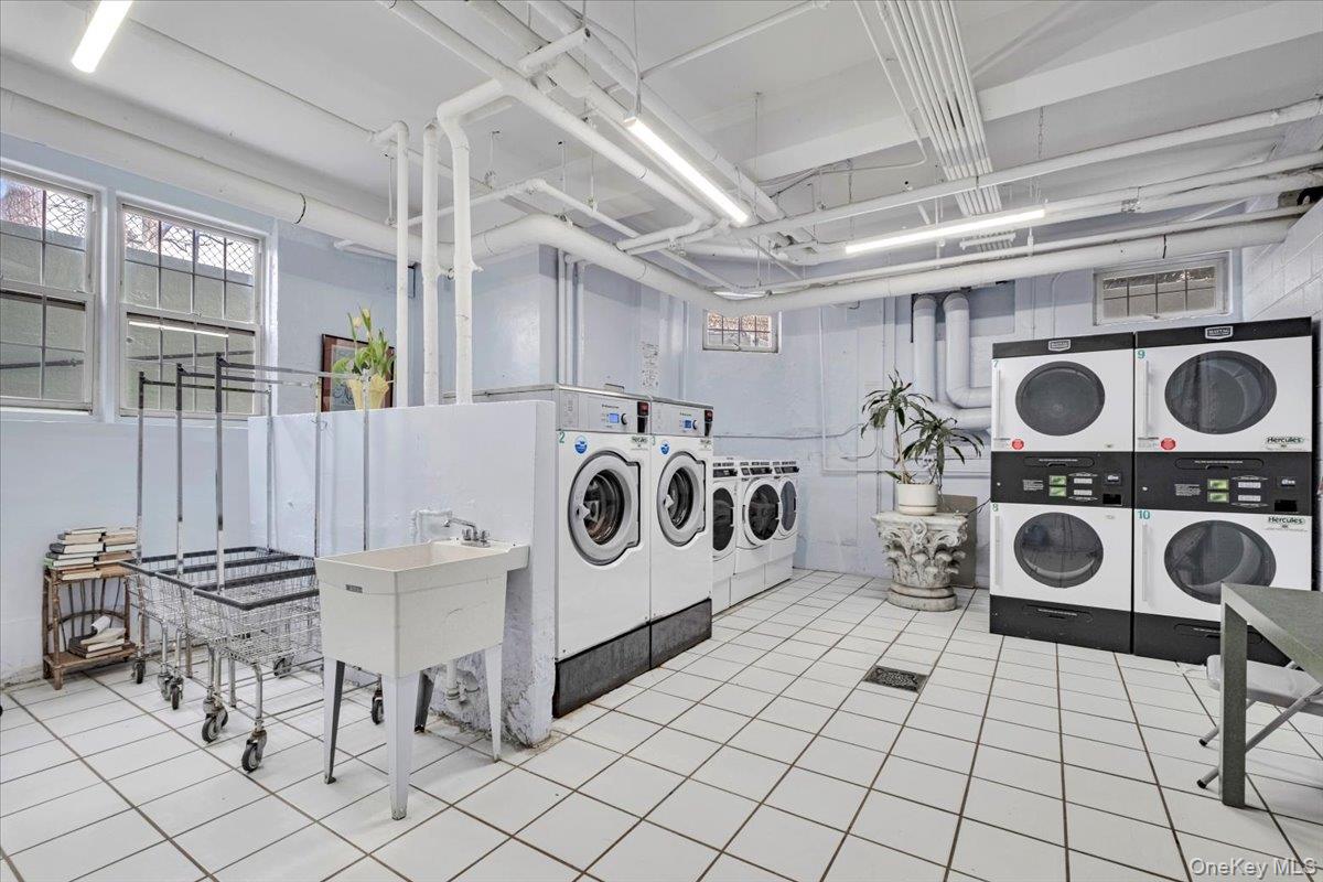 45 Popham Road, Unit 1E Scarsdale, NY 10583 - Photo 16 of 24 a utility room with dryer washer and dryer