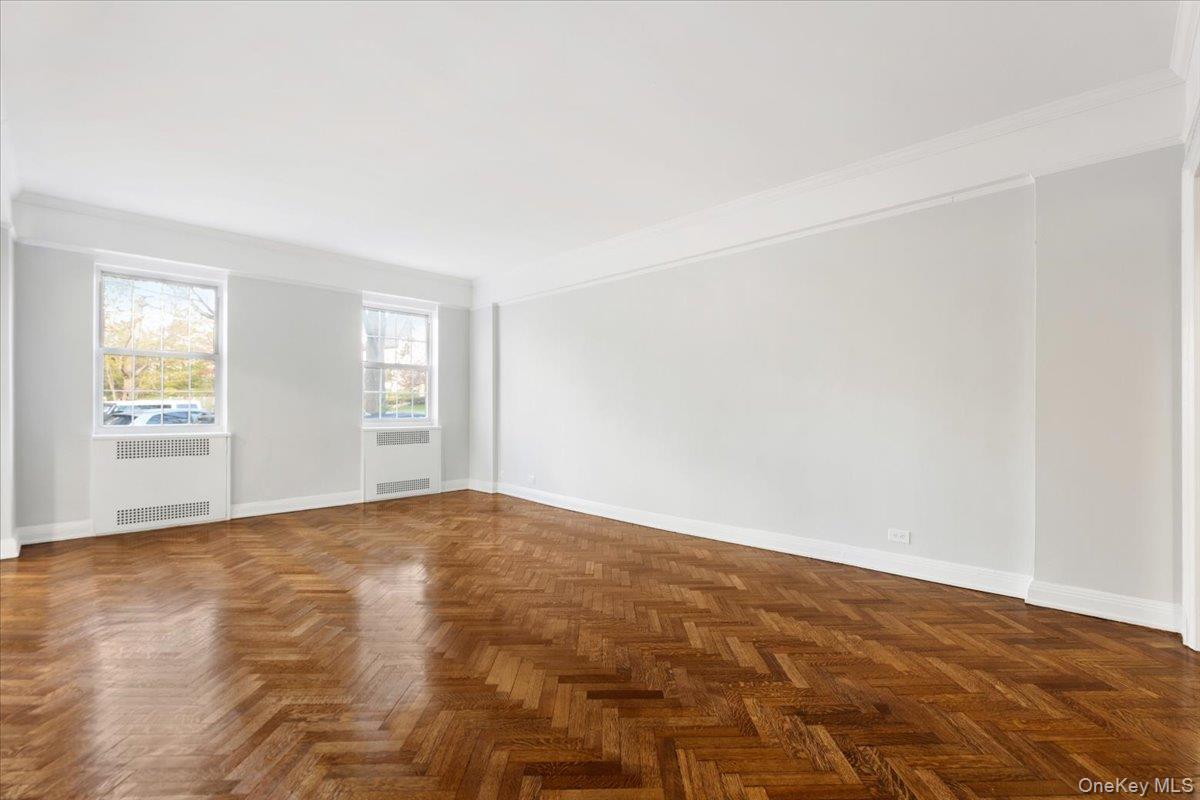 45 Popham Road, Unit 1E Scarsdale, NY 10583 - Photo 6 of 24 a view of an empty room with window