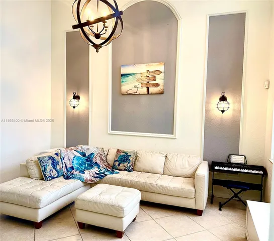 a view of a room with gym equipment and windows