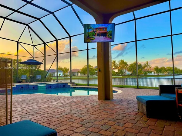 an aerial view of a house with a yard and potted plants
