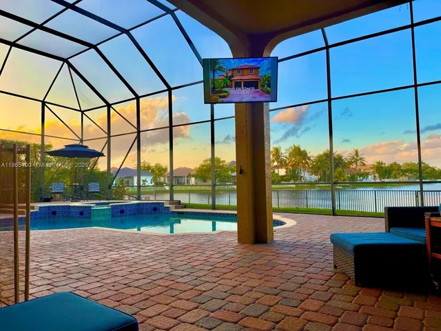 a aerial view of a house with a yard and a fountain