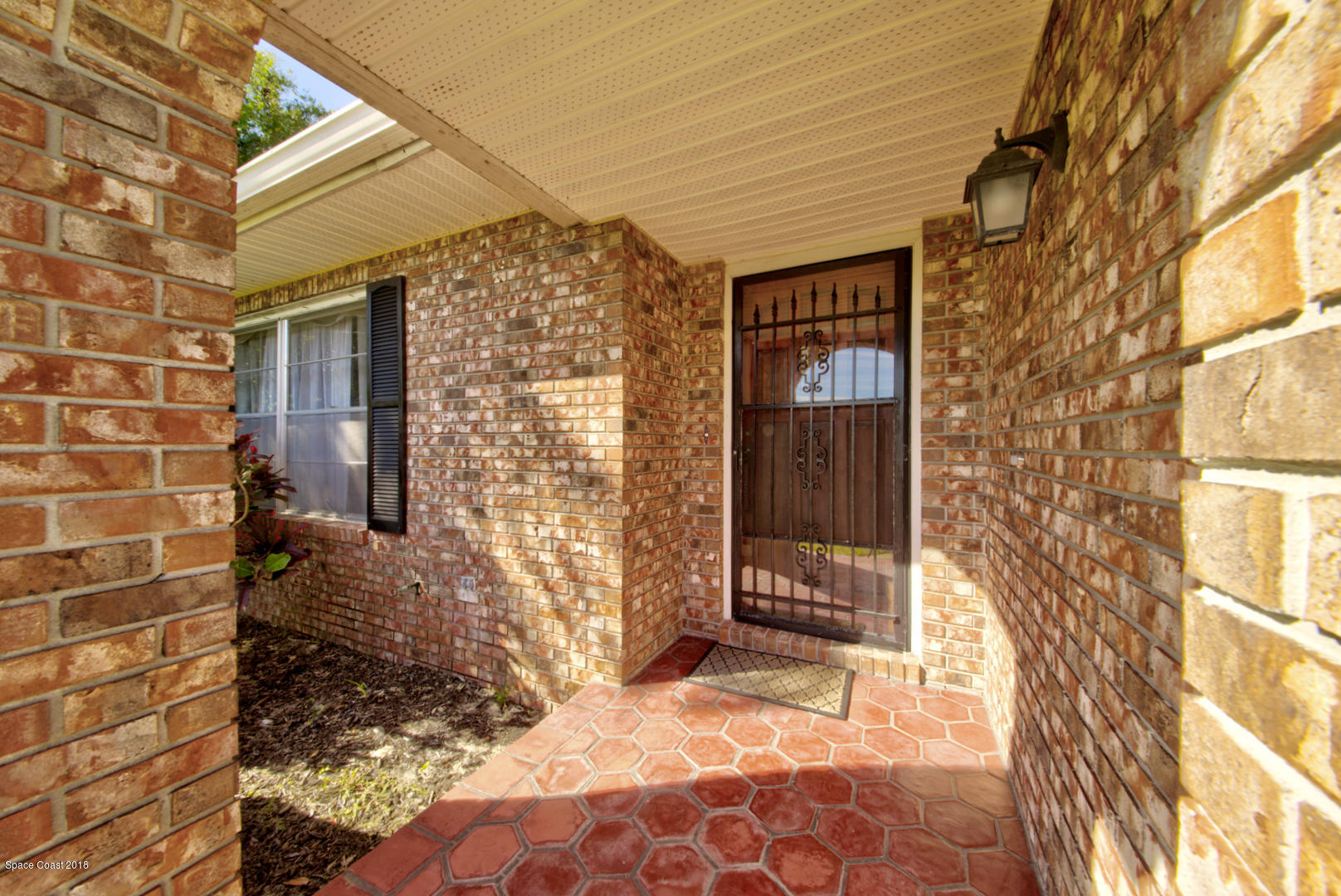 1030 Sunswept Road Northeast Palm Bay, FL 32905 - Photo 2 of 39 covered front entry
