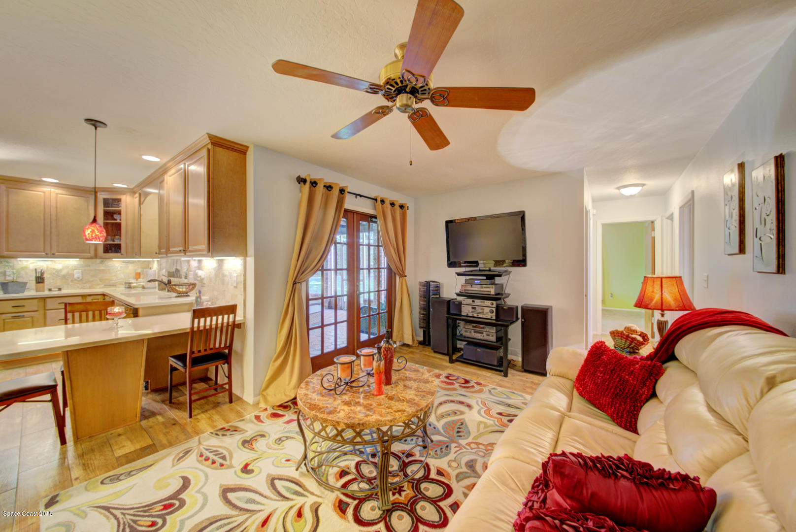 1030 Sunswept Road Northeast Palm Bay, FL 32905 - Photo 11 of 39 family room open to kitchen