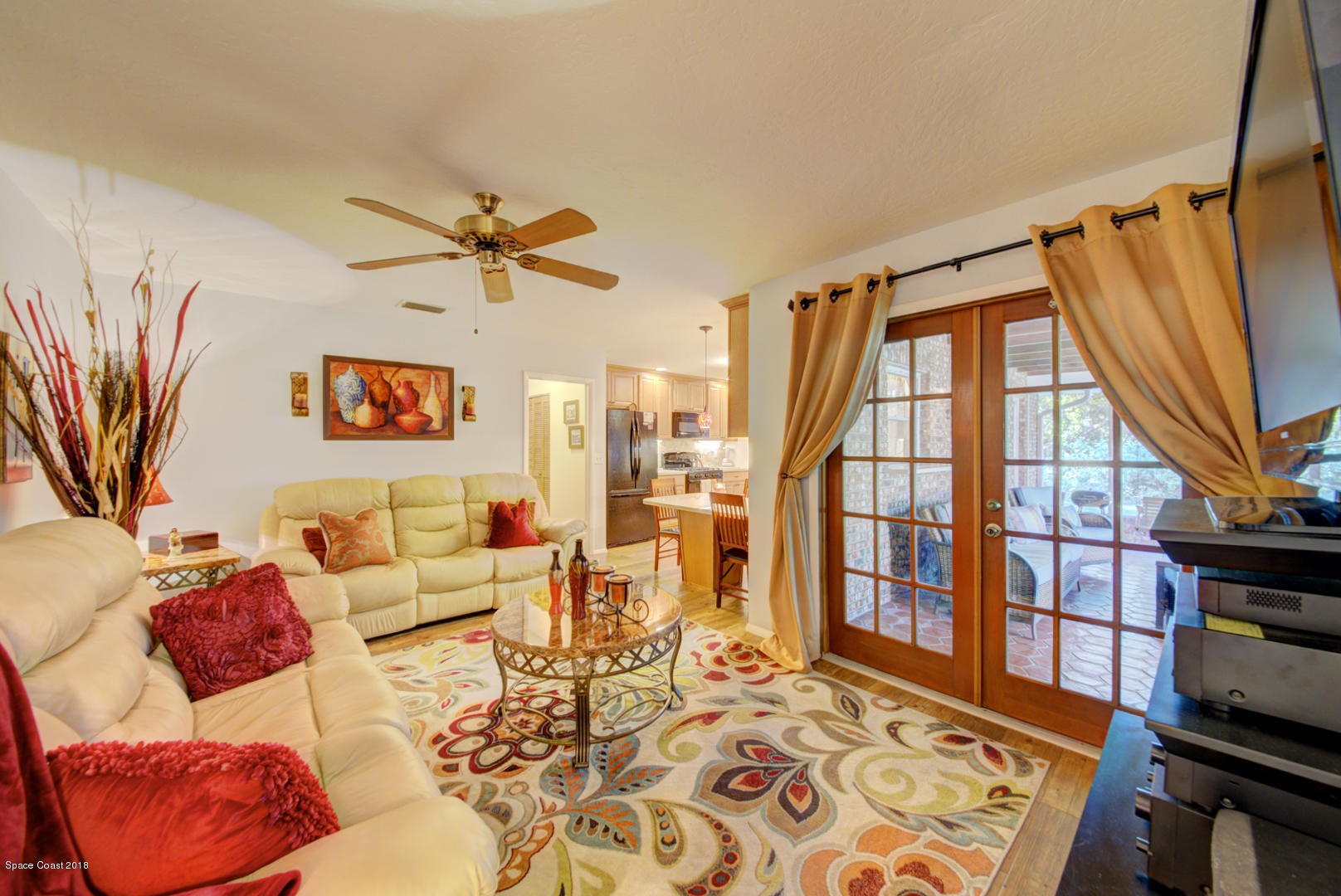1030 Sunswept Road Northeast Palm Bay, FL 32905 - Photo 12 of 39 family room with French doors to porch
