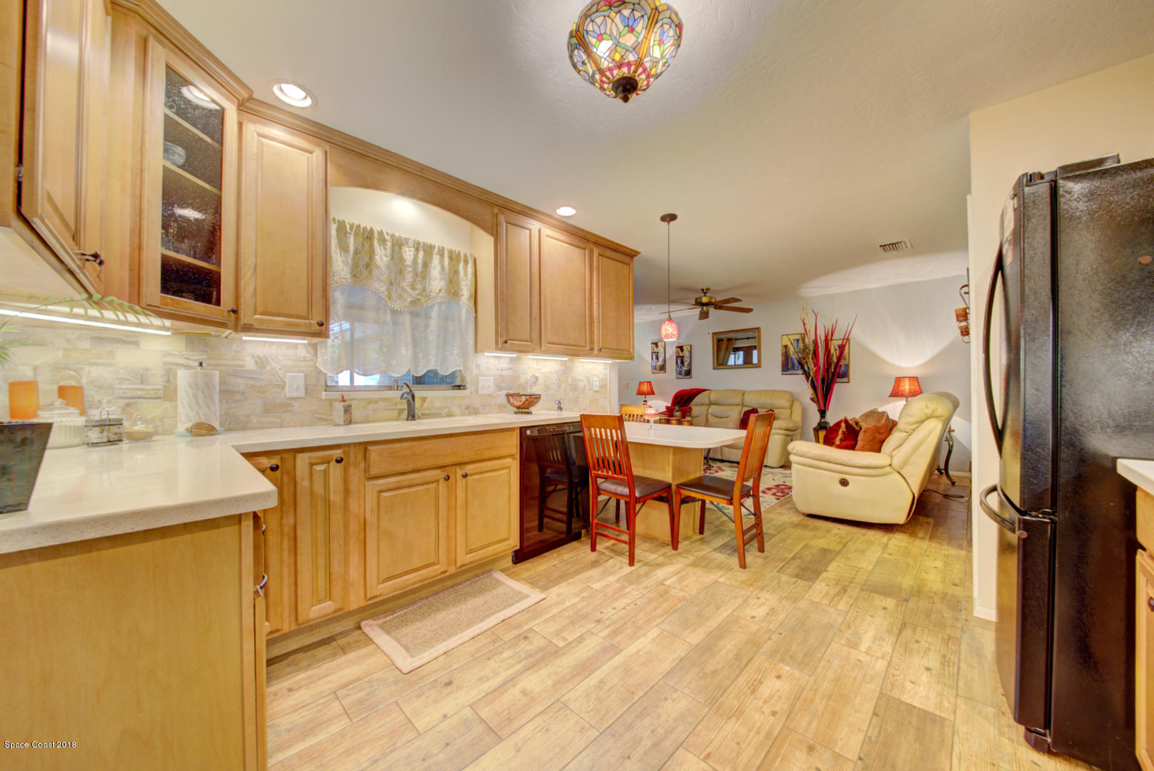 1030 Sunswept Road Northeast Palm Bay, FL 32905 - Photo 15 of 39 kitchen open to family room