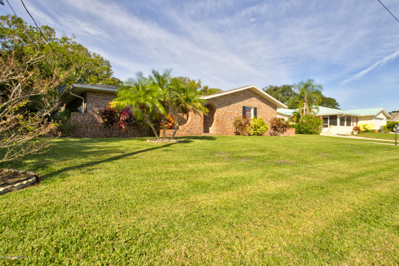 1030 Sunswept Road Northeast Palm Bay, FL 32905 - Photo 3 of 39 front of house left