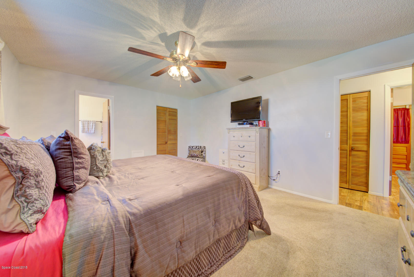1030 Sunswept Road Northeast Palm Bay, FL 32905 - Photo 31 of 39 master bedroom with ensuite