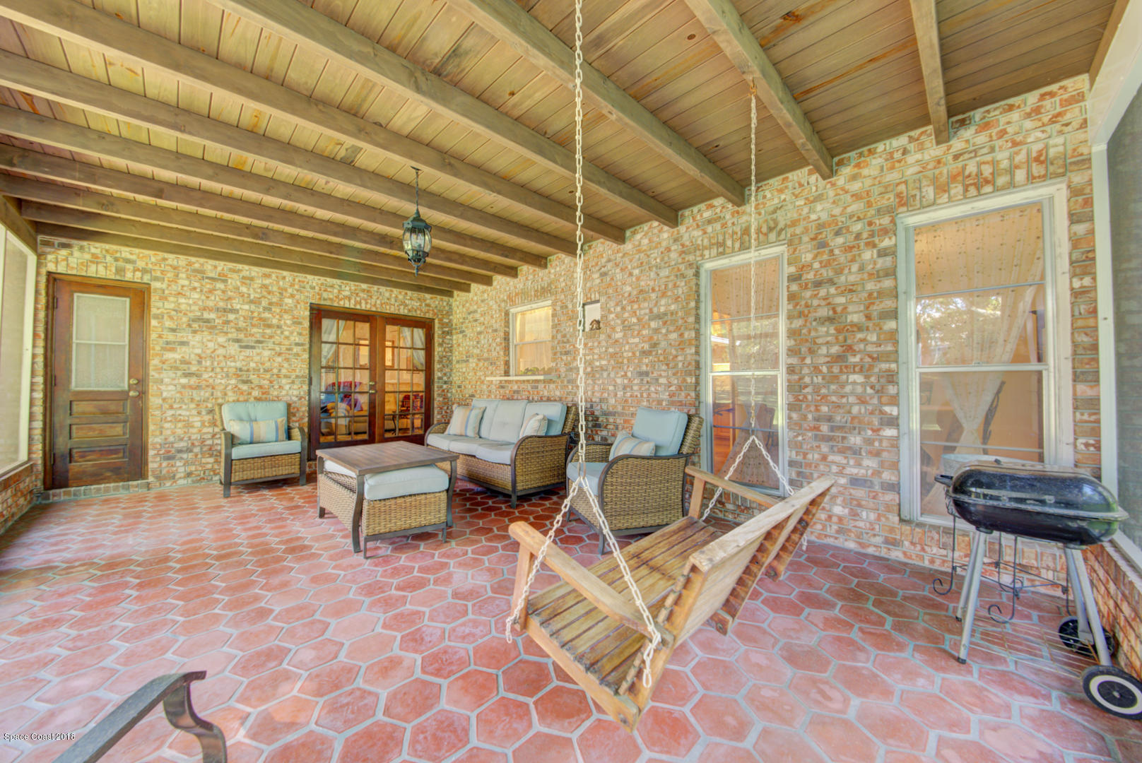 1030 Sunswept Road Northeast Palm Bay, FL 32905 - Photo 7 of 39 back porch with swing