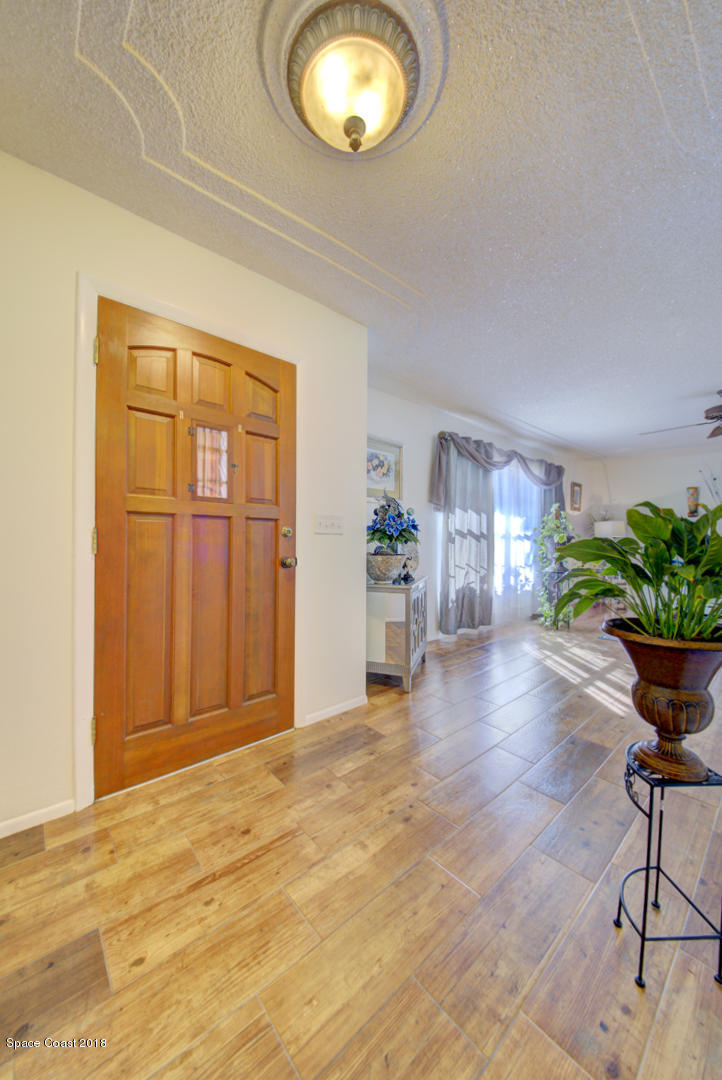 1030 Sunswept Road Northeast Palm Bay, FL 32905 - Photo 9 of 39 foyer