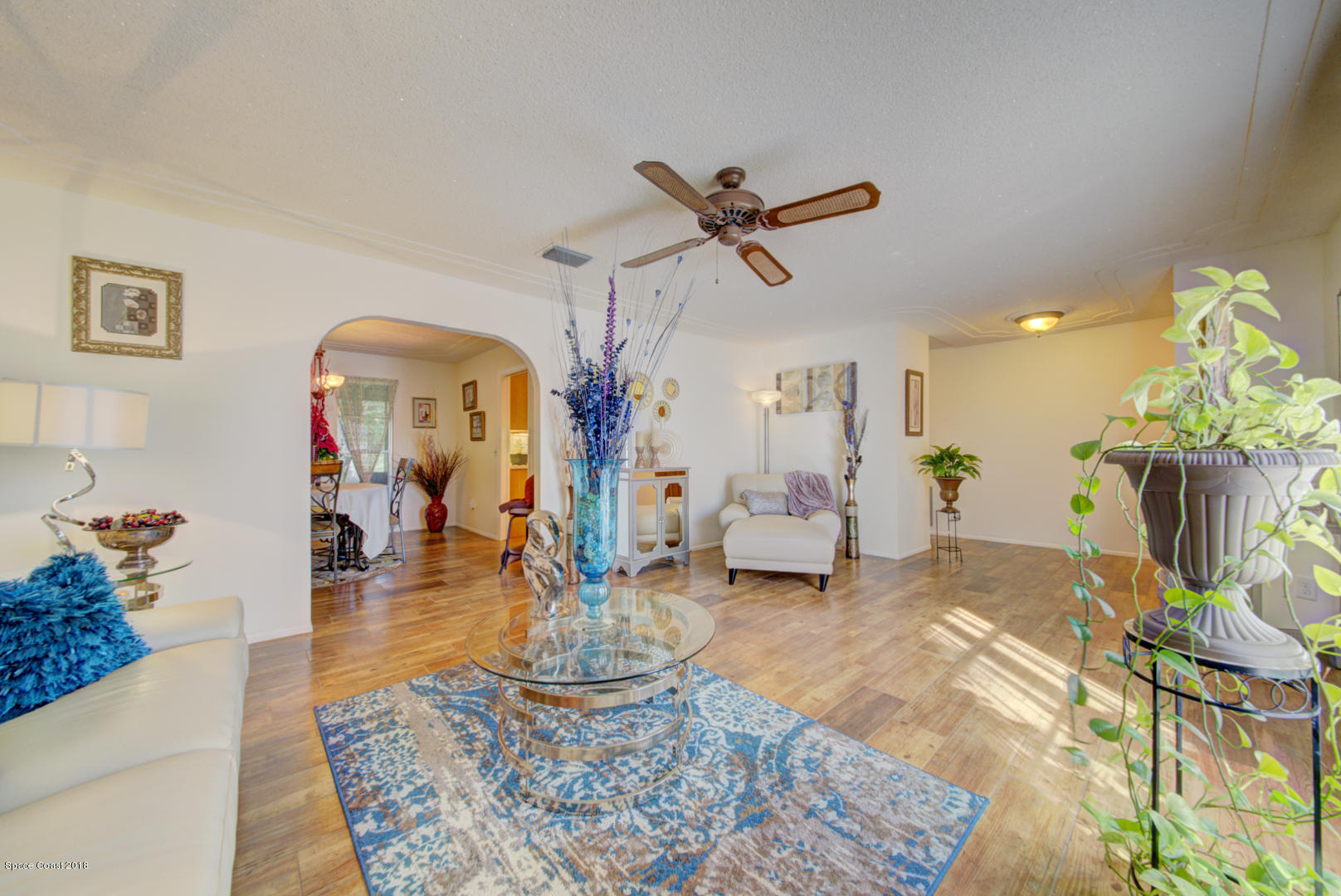 1030 Sunswept Road Northeast Palm Bay, FL 32905 - Photo 10 of 39 living room with entry to dining room