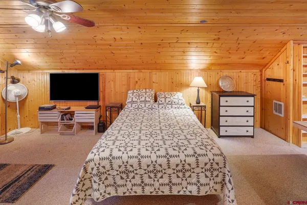 a view of a livingroom with furniture