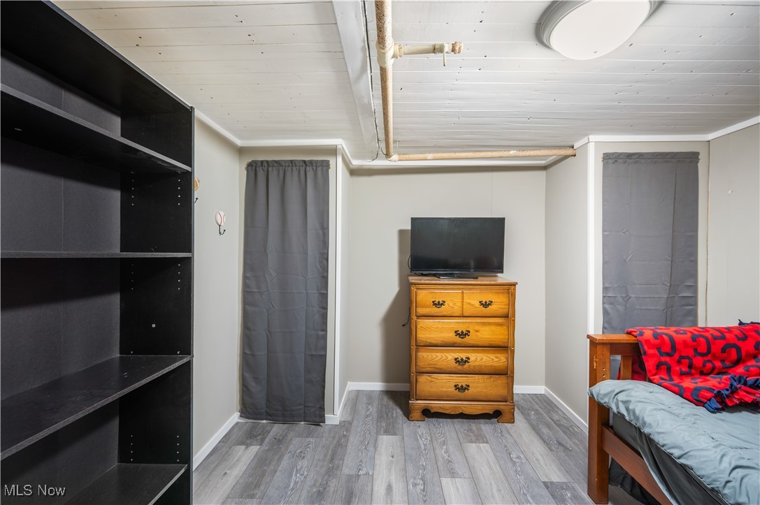 1615 Wooster Road West Barberton, OH 44203 - Photo 20 of 28 Bedroom with wood finished floors, wood ceiling, and baseboards