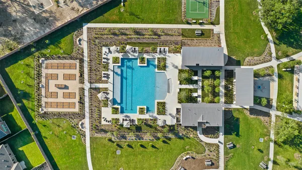 aerial view of a house with balcony and garden