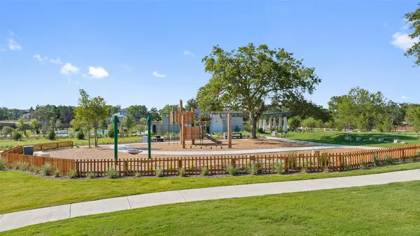 a view of a swimming pool and trees in the background