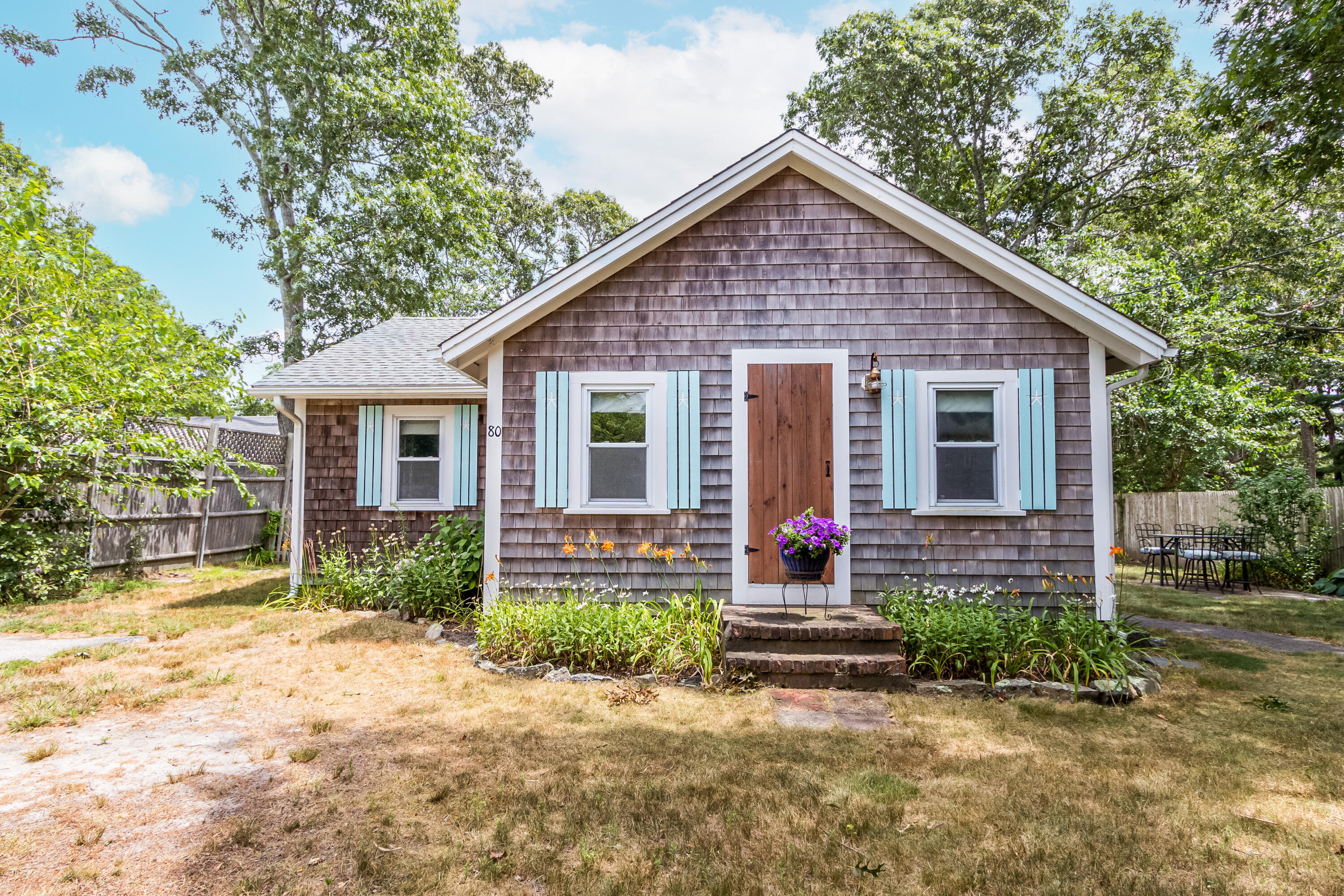 80 North Main Street South Yarmouth, MA 02664 - Photo 1 of 24 a front view of house with yard and green space