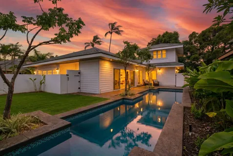 a front view of a house with garden