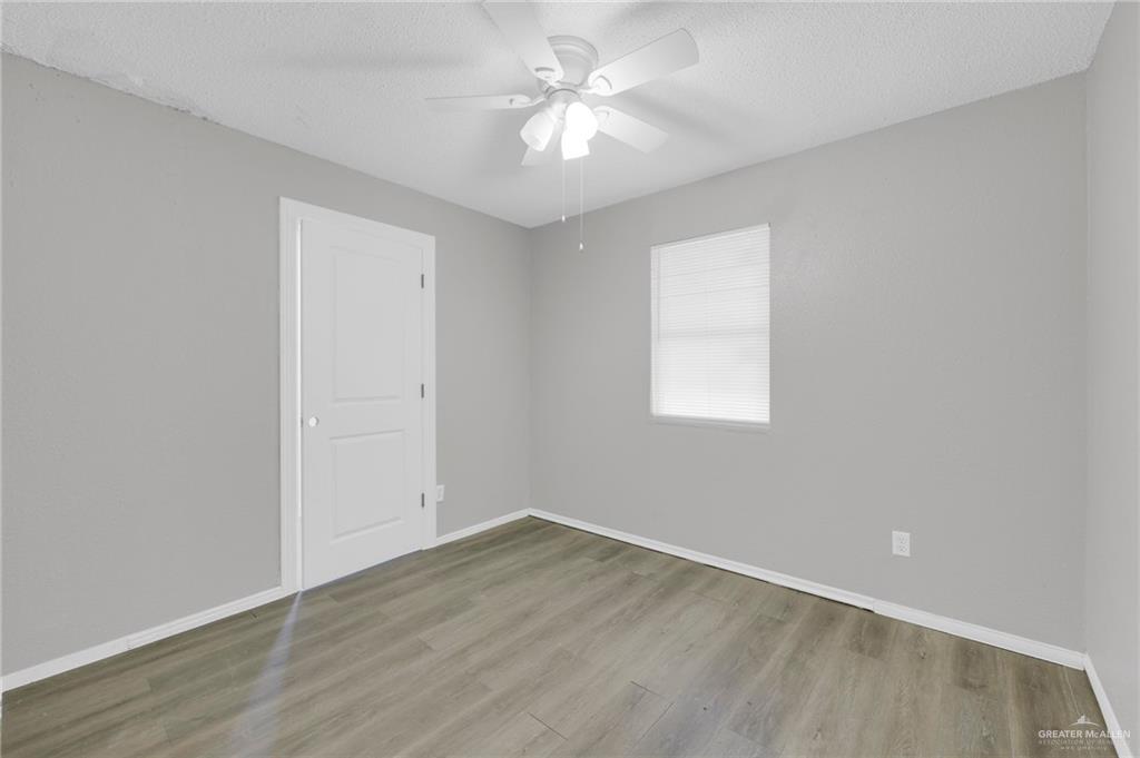 4913 South 26th Street McAllen, TX 78503 - Photo 12 of 15 wooden floor in an empty room