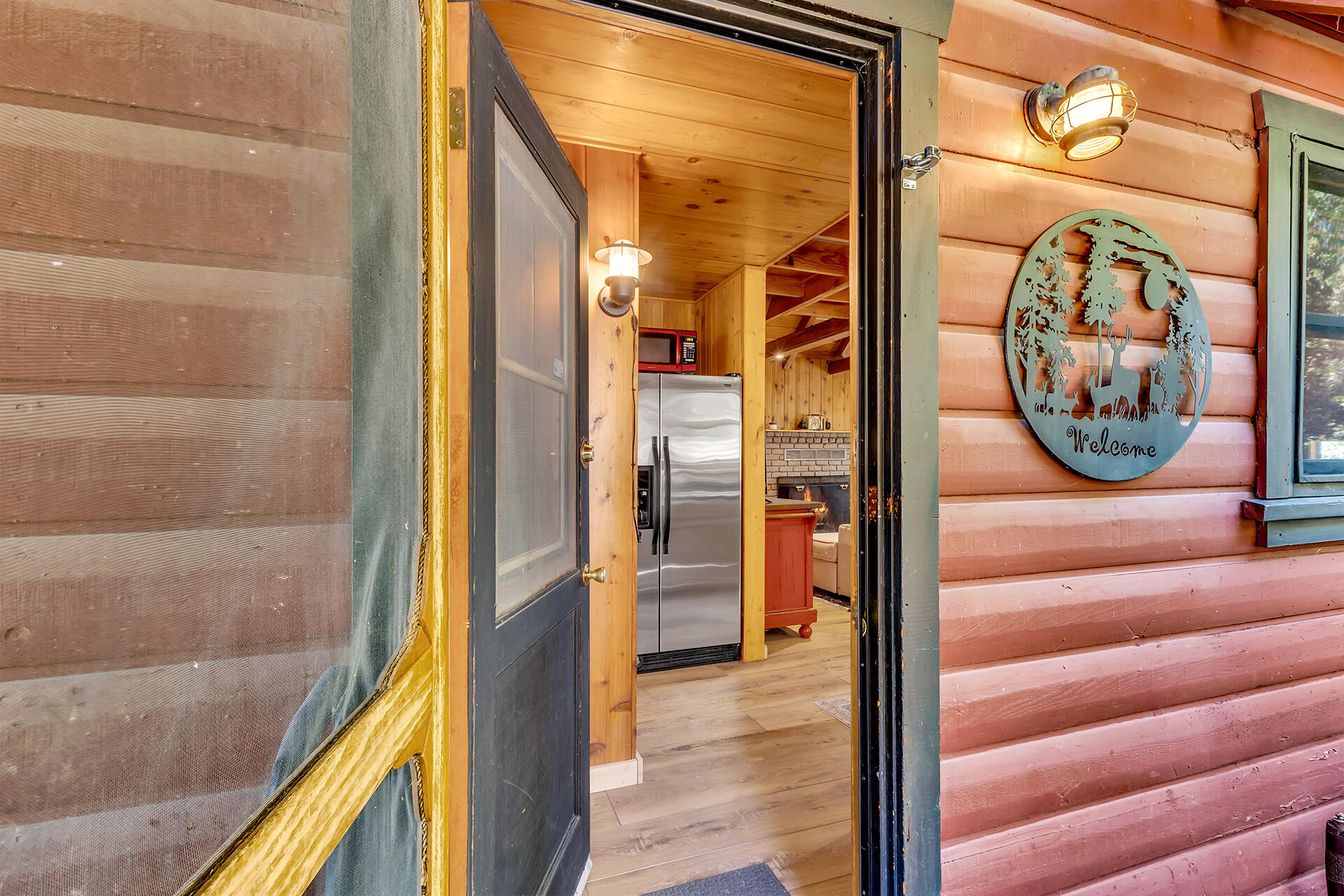 52646 Chickadee Lane Idyllwild, CA 92549 - Photo 12 of 73 a view of a hallway with wooden floor and windows