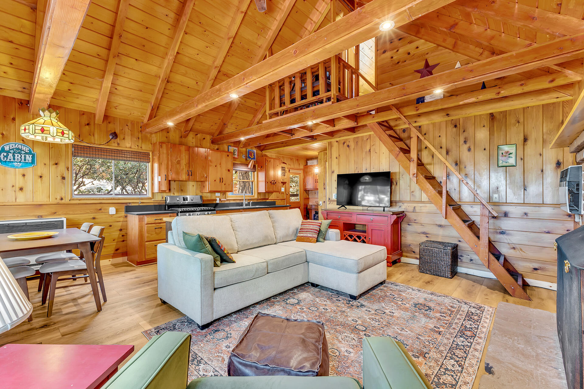 52646 Chickadee Lane Idyllwild, CA 92549 - Photo 4 of 73 a living room with furniture a rug and white walls