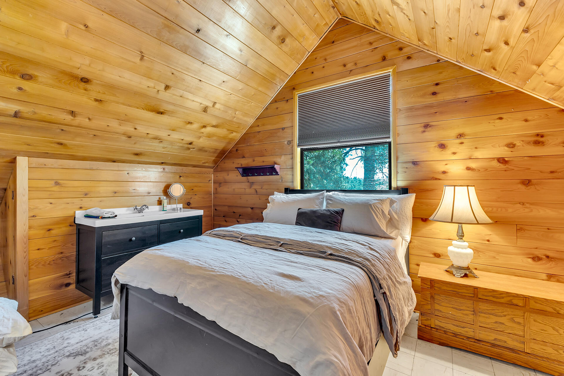 52646 Chickadee Lane Idyllwild, CA 92549 - Photo 41 of 73 a bed sitting in a bedroom next to a window