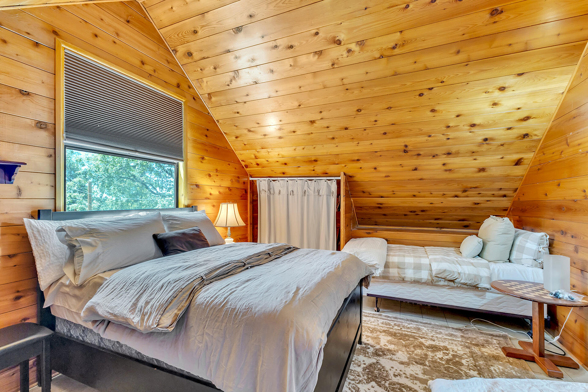 52646 Chickadee Lane Idyllwild, CA 92549 - Photo 42 of 73 a bedroom with a bed and wooden floor