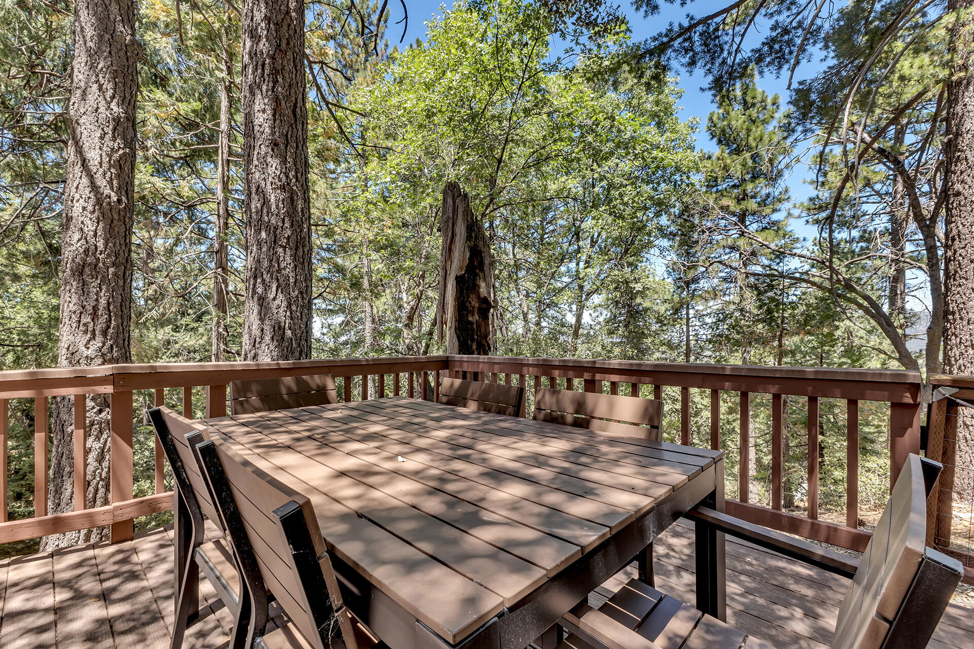 52646 Chickadee Lane Idyllwild, CA 92549 - Photo 51 of 73 a view of a balcony with a table and chairs