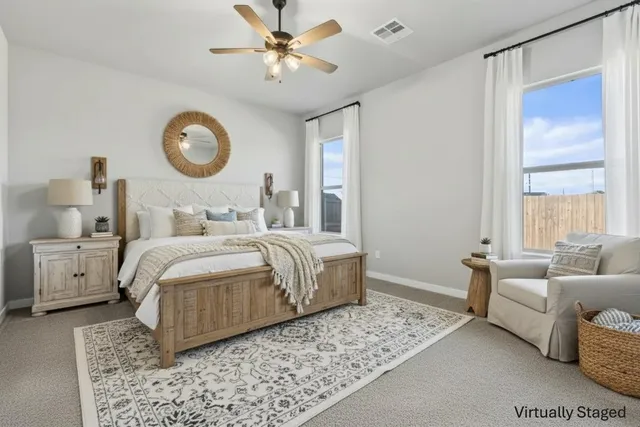 an empty room with wooden floor and a bathroom