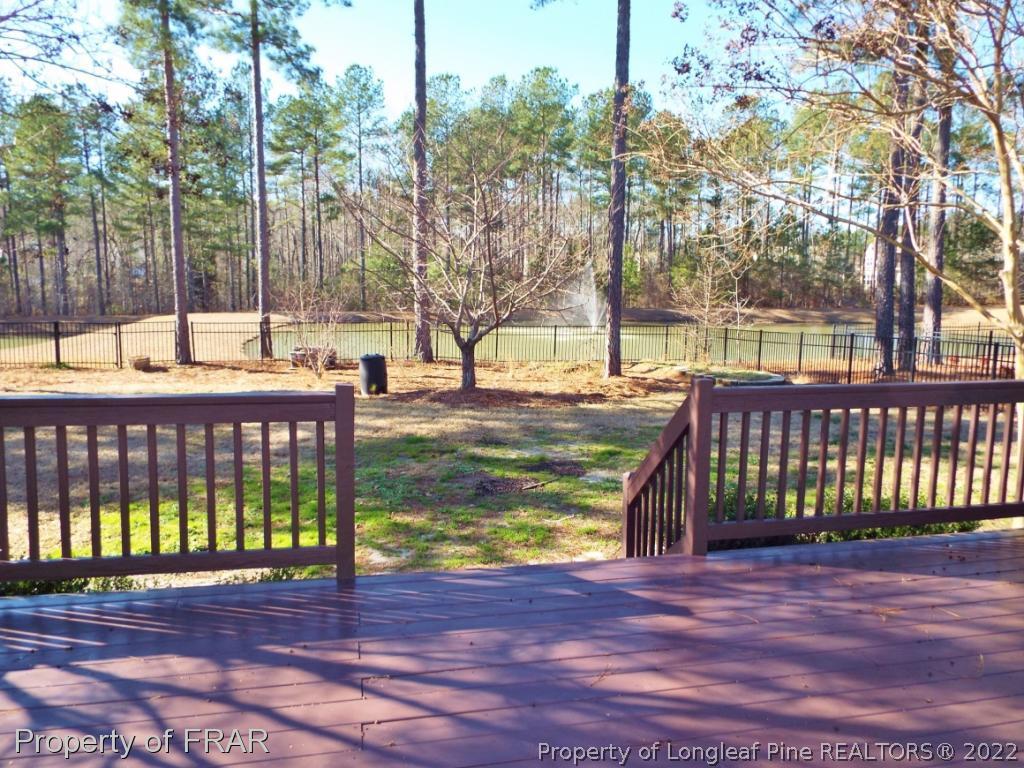 239 Falling Water Road Spring Lake, NC 28390 - Photo 2 of 36 a view of outdoor space with deck and a garden