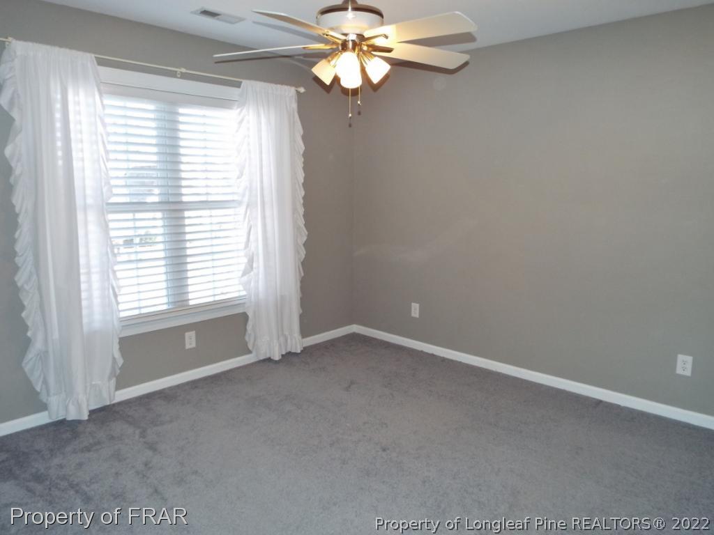 239 Falling Water Road Spring Lake, NC 28390 - Photo 29 of 36 a view of an empty room with a window
