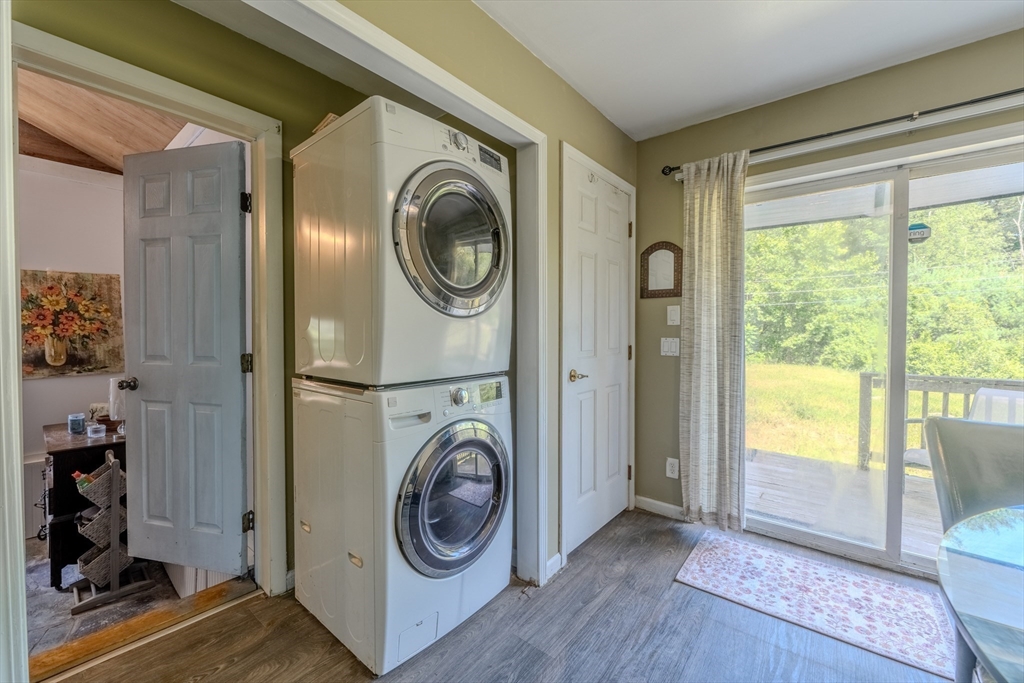 66 Great Road Shirley, MA 01464 - Photo 13 of 40 a view of a hallway with washer and dryer next to a window