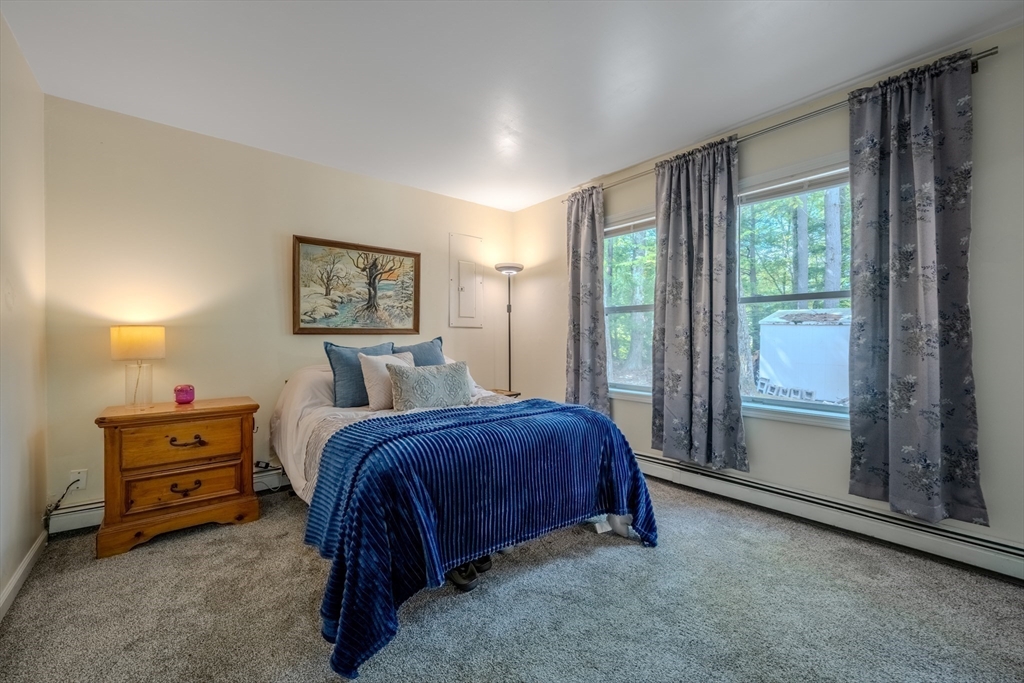 66 Great Road Shirley, MA 01464 - Photo 20 of 40 a bed room with a bed and a window