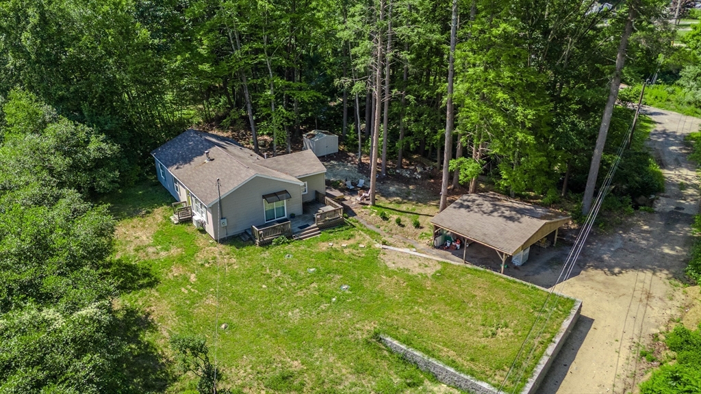 66 Great Road Shirley, MA 01464 - Photo 2 of 40 an aerial view of a garden with a patio