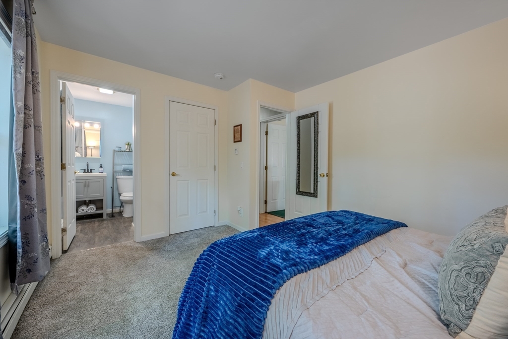 66 Great Road Shirley, MA 01464 - Photo 23 of 40 a bedroom with a bed and a view of bathroom