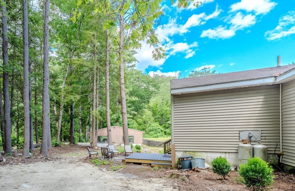 66 Great Road Shirley, MA 01464 - Photo 31 of 40 a view of a house with backyard and trees