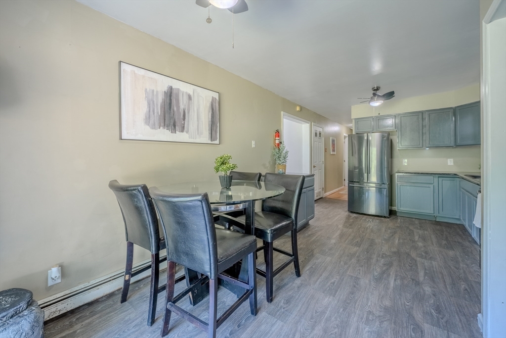 66 Great Road Shirley, MA 01464 - Photo 6 of 40 a view of a dining room with furniture and wooden floor
