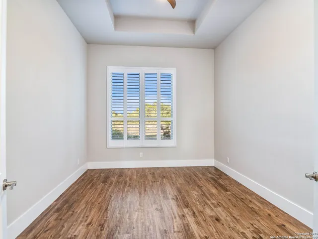 a view of a swimming pool with a yard