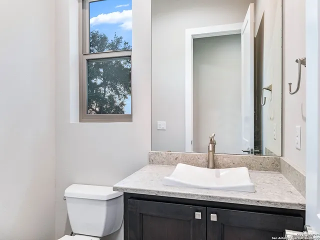 a view of a house with swimming pool and a yard