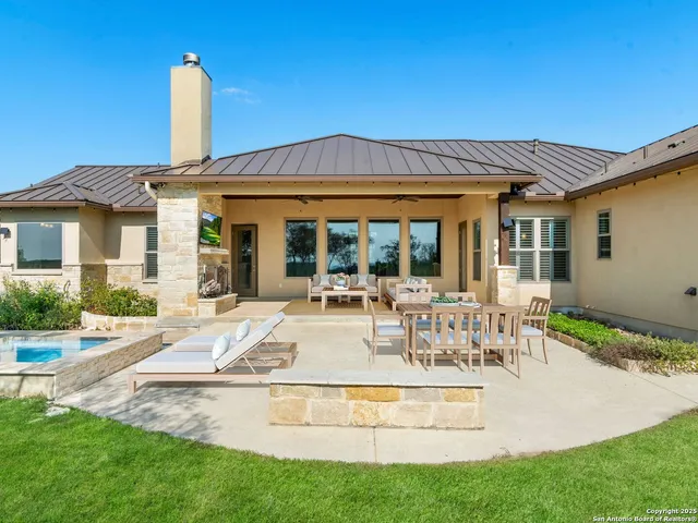 an aerial view of a house with lake view