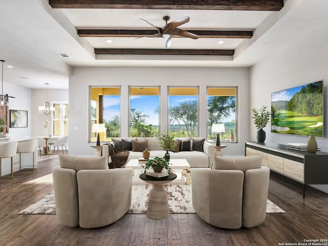 a bedroom with a balcony a bed couch and a large window