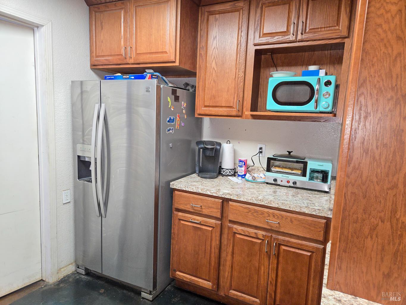 4300 North State Street Ukiah, CA 95482 - Photo 15 of 22 a kitchen with stainless steel appliances granite countertop a refrigerator and a stove