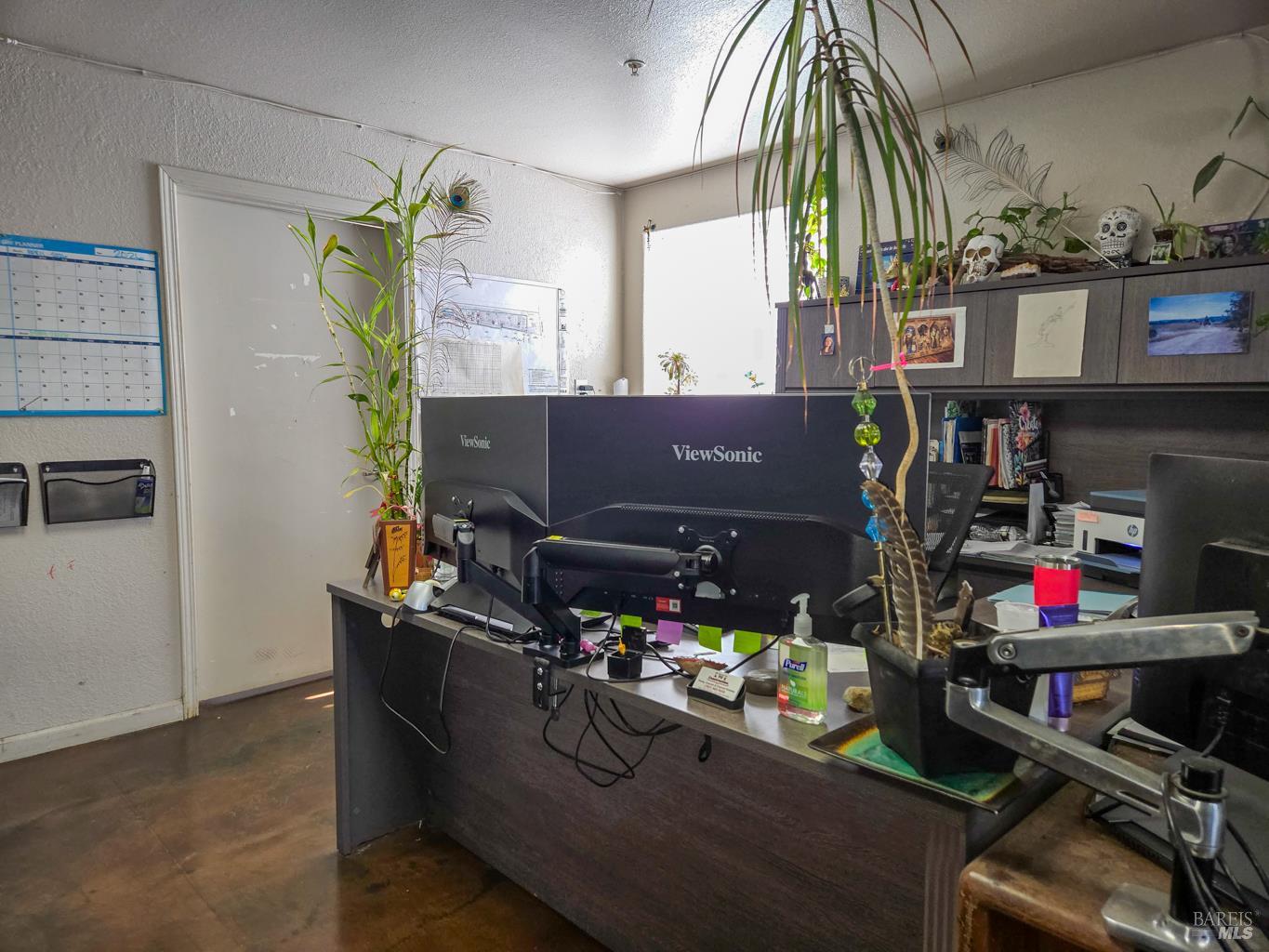 4300 North State Street Ukiah, CA 95482 - Photo 19 of 22 a room with lots of different colored cloths and a potted plant