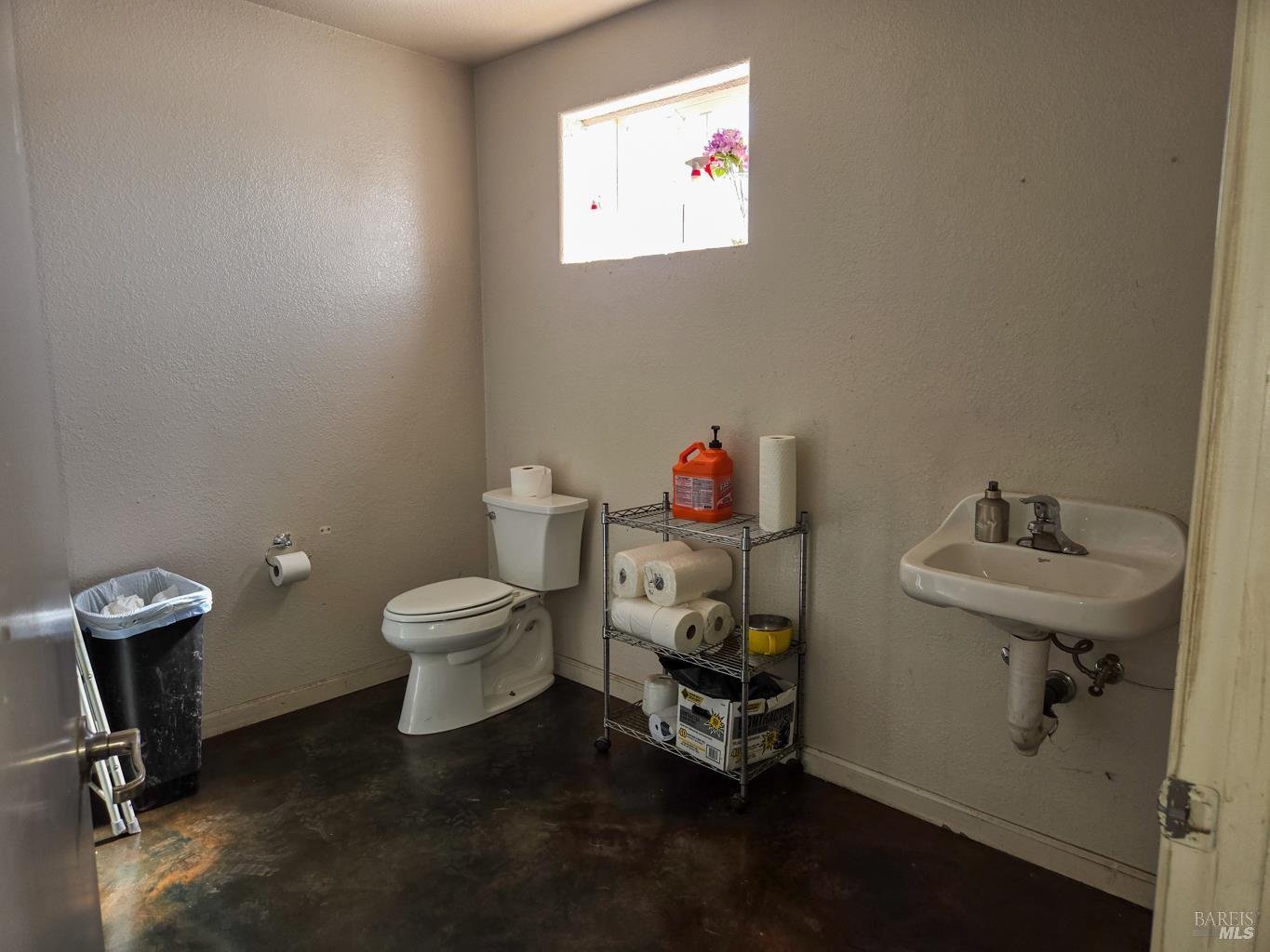 4300 North State Street Ukiah, CA 95482 - Photo 20 of 22 a bathroom with a toilet sink and mirror