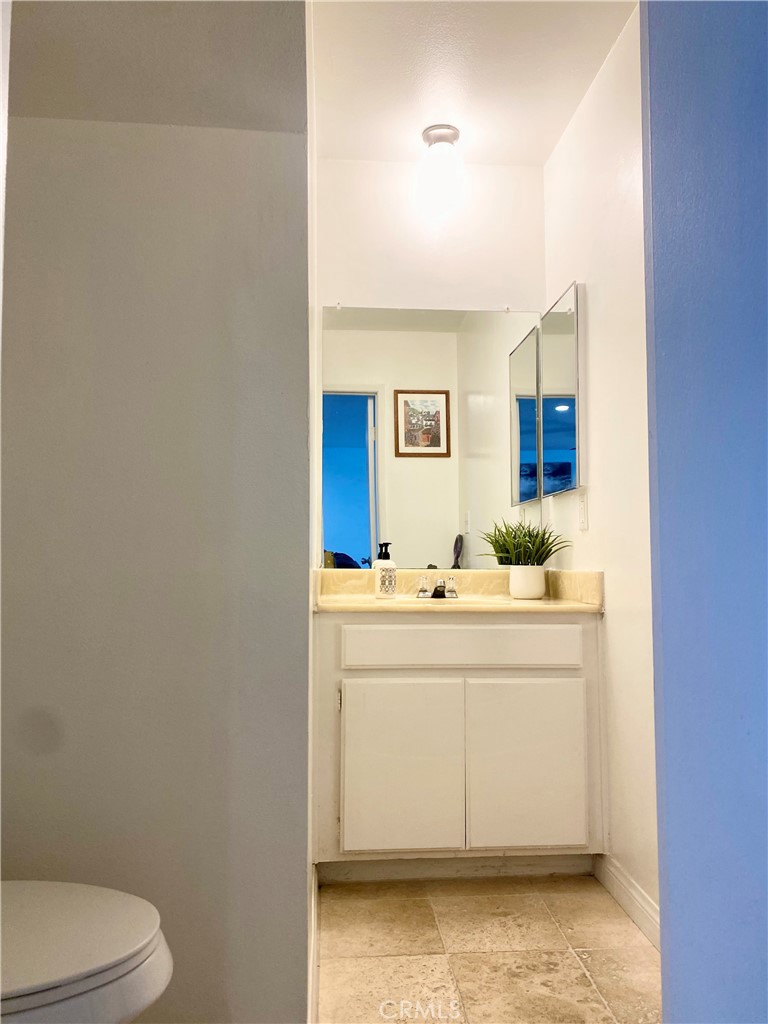1450 West 146th Street, Unit 2 Gardena, CA 90247 - Photo 14 of 33 a bathroom with a sink toilet and mirror