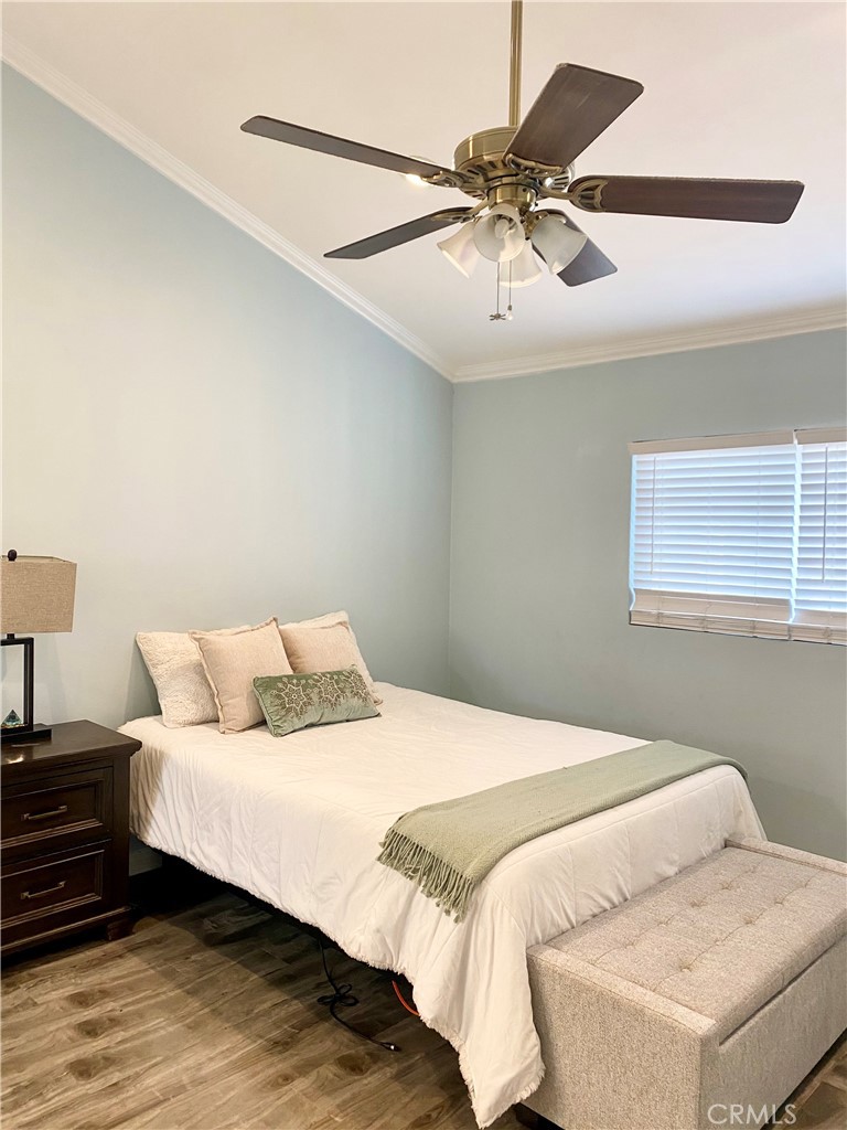1450 West 146th Street, Unit 2 Gardena, CA 90247 - Photo 17 of 33 a bedroom with a bed and ceiling fan