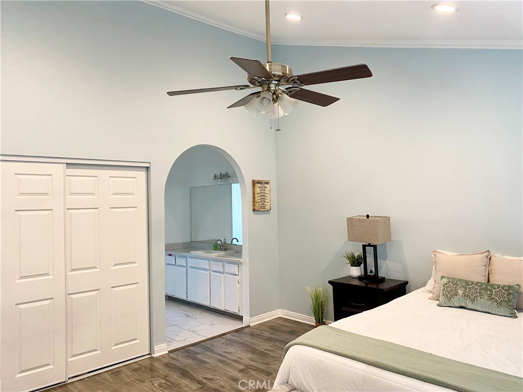 1450 West 146th Street, Unit 2 Gardena, CA 90247 - Photo 20 of 33 a bedroom with a bed and a chandelier