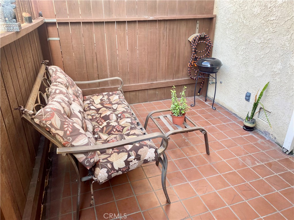 1450 West 146th Street, Unit 2 Gardena, CA 90247 - Photo 31 of 33 a view of a chairs and table in the balcony