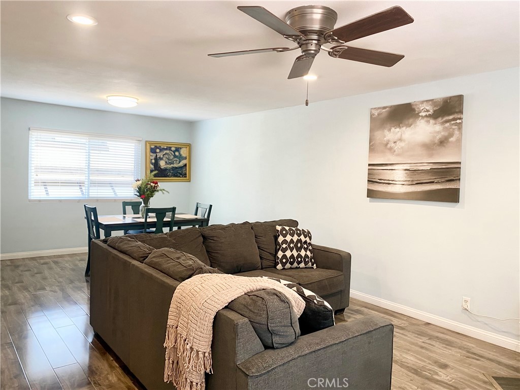 1450 West 146th Street, Unit 2 Gardena, CA 90247 - Photo 7 of 33 a living room with furniture and a wooden floor