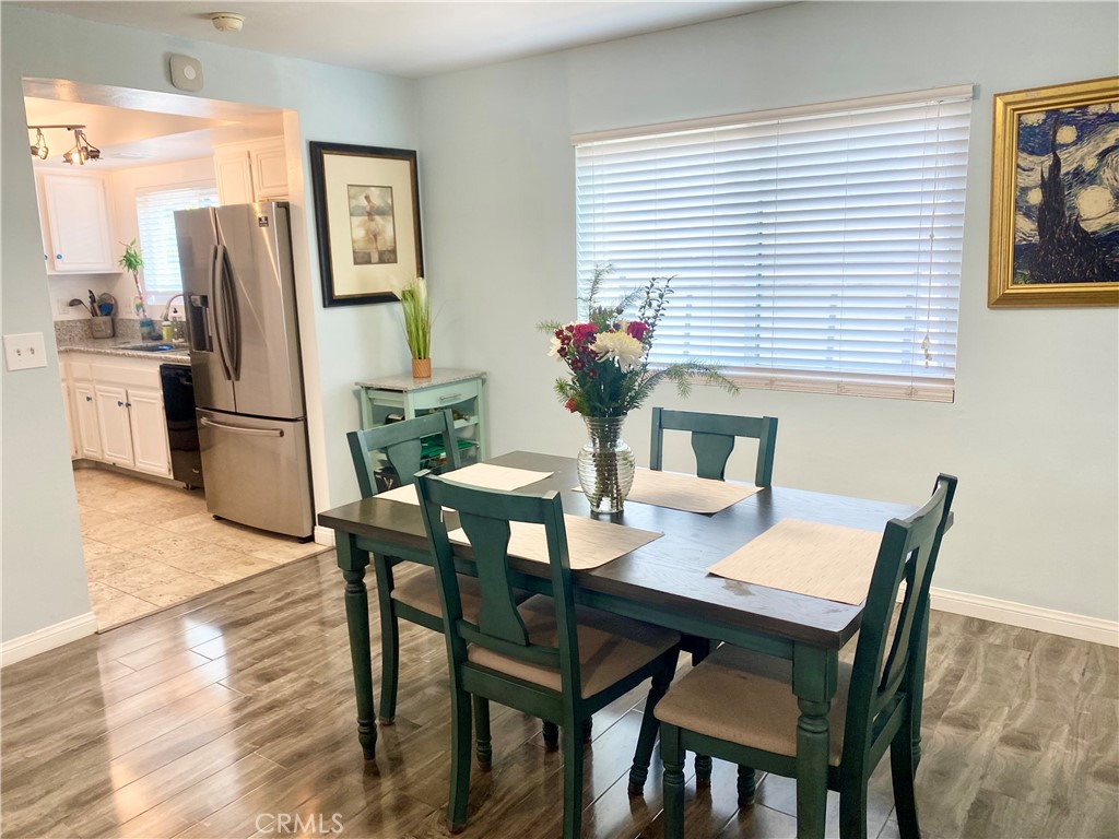 1450 West 146th Street, Unit 2 Gardena, CA 90247 - Photo 9 of 33 a view of a dining room with furniture and a potted plant